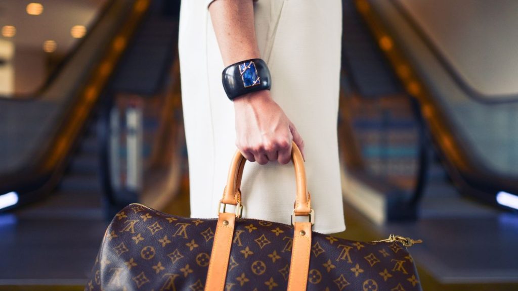 woman with luxury bag louis Vuitton  destinations to go shopping, where to shop